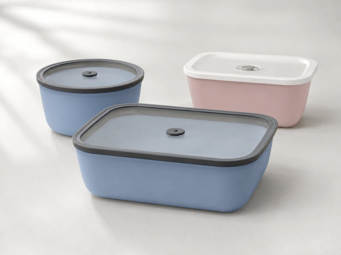 Full-Coat blue and pink silicone-coated glass containers